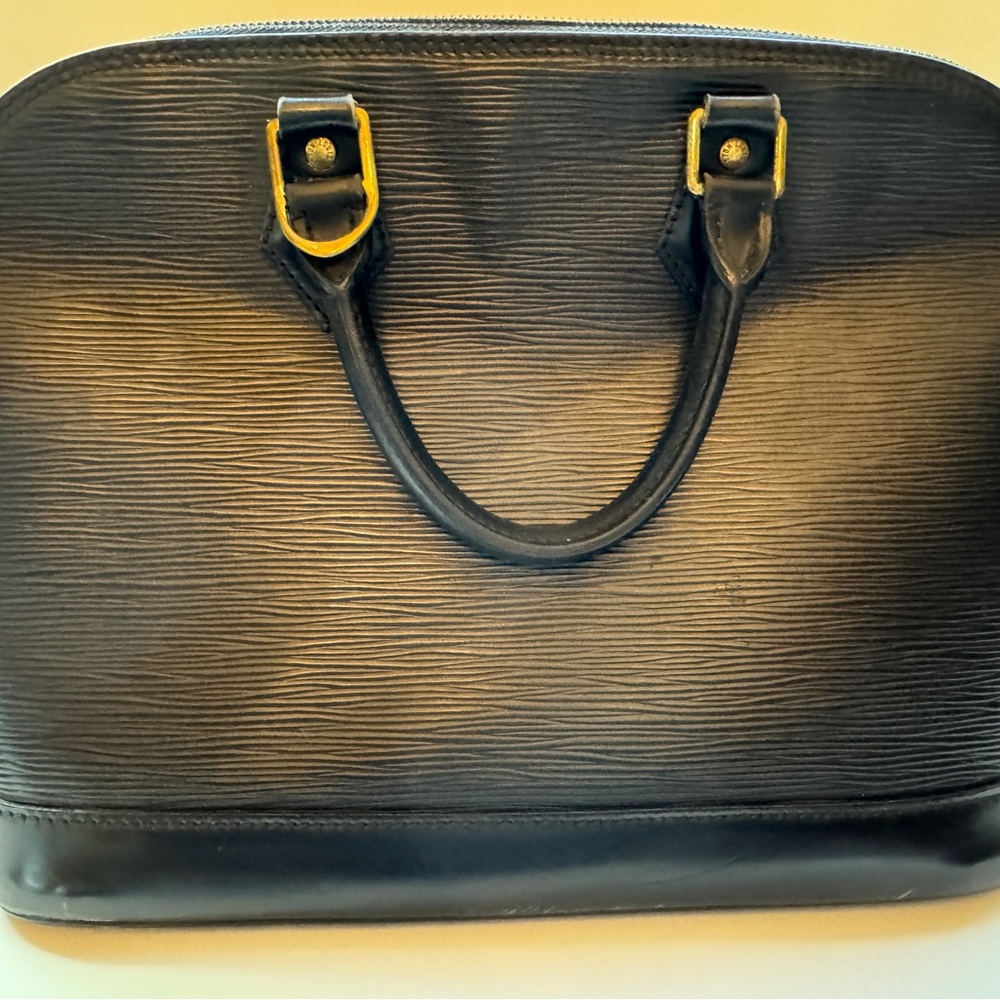 Louis Vuitton epi leather Black Textured Handbag with Gold Accents